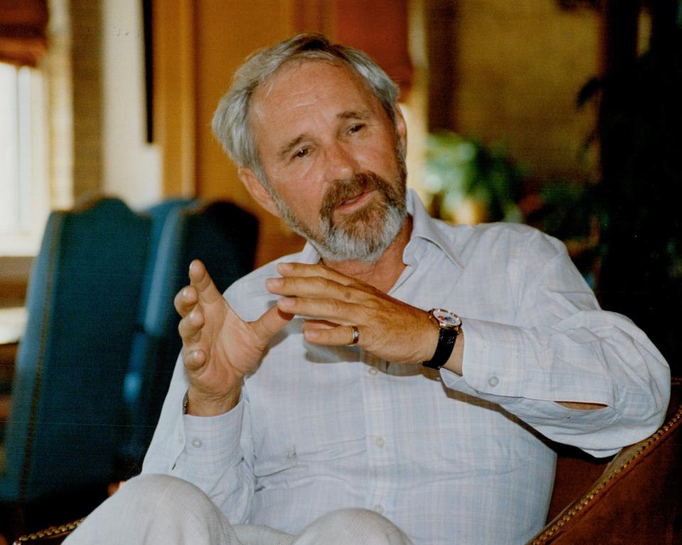Norman Jewison in a button-down shirt