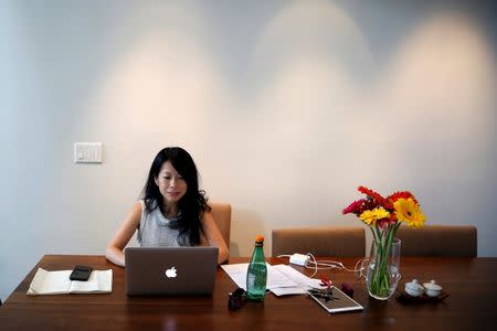 Venture capitalist Eva Ho, 44, who runs a seed fund, works on her computer in Los Angeles, California, United States, June 21, 2016. REUTERS/Lucy Nicholson