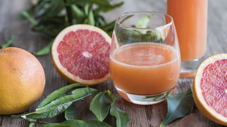 Grapefruit and juice in a glass
