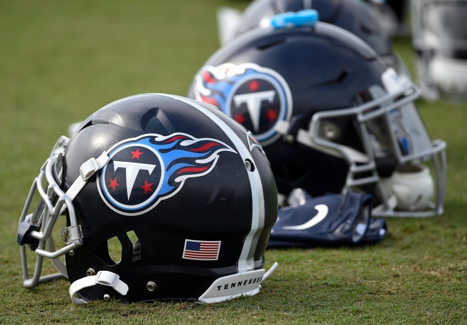 Titans helmets rest on the field during practice at Saint Thomas Sports Park Thursday, Aug. 1, 2019, in Nashville, Tenn. 