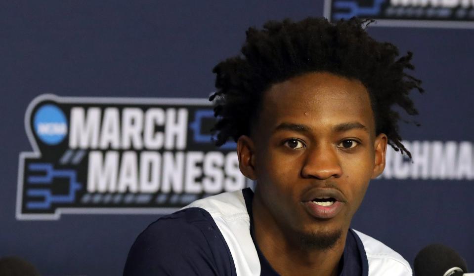 Akron's Ali Ali fields questions from members of the media during a news conference before an open practice Wednesday at PPG Paints Arena in preparation for the Zips' first-round NCAA Tournament game against Creighton on Thursday in Pittsburgh.