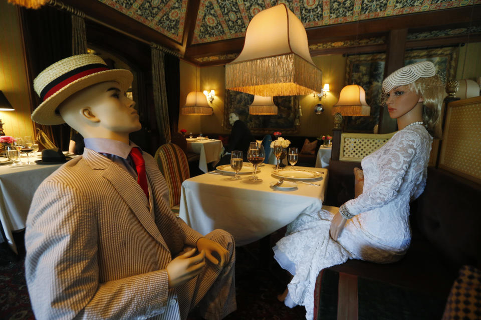 Mannequins provide social distancing at the Inn at Little Washington as they prepare to reopen their restaurant Thursday May 14, 2020, in Washington, Va. The manager say that every other table will have mannequins for social distance guidance when, according to state guidelines, the 5-star restaurant will be allowed reopen on May 29th. (AP Photo/Steve Helber)