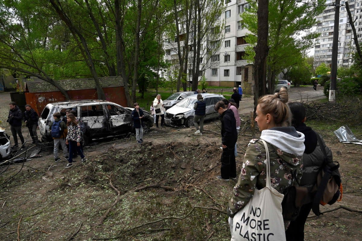 A crater near homes in Kyiv caused by a Russian drone (AFP)