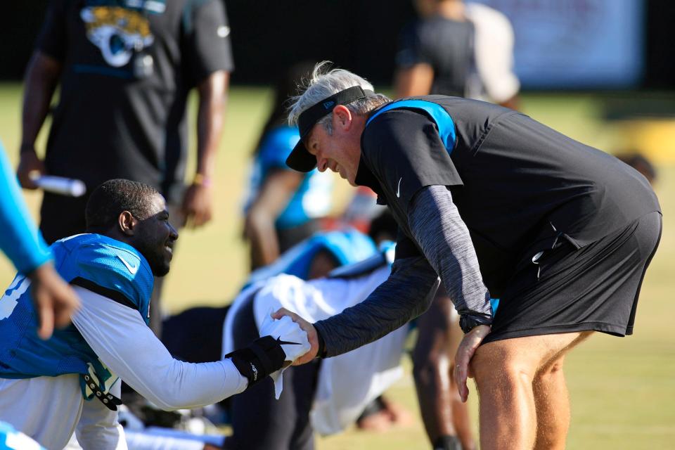 Jaguars coach Doug Pederson (right) and general manager Trent Baalke brought in linebacker Foyesade Oluokun (left) to beef up the team's run defense.