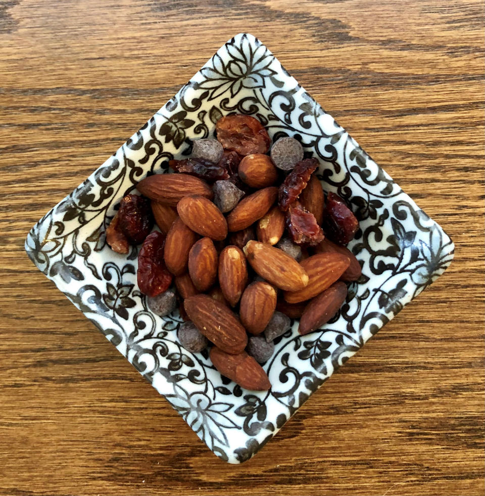 An ounce of nuts with 2 tablespoons dried cranberries and 1 tablespoon chocolate chips. (Heather Martin)
