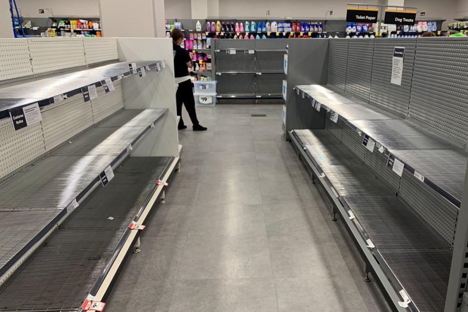 Supermarket shelves have been left bare as the virus spreads. Photo: AAP