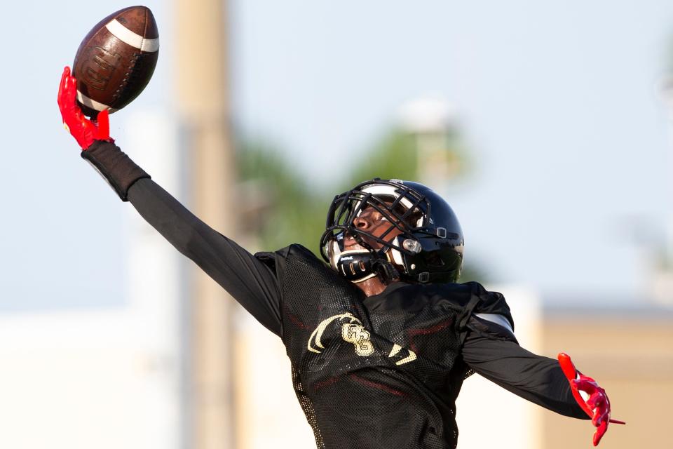 Golden Gate wide receiver Bradley Martino attempts a one-handed catch during practice, Tuesday, Aug. 9, 2022, at Golden Gate High School in Naples, Fla.