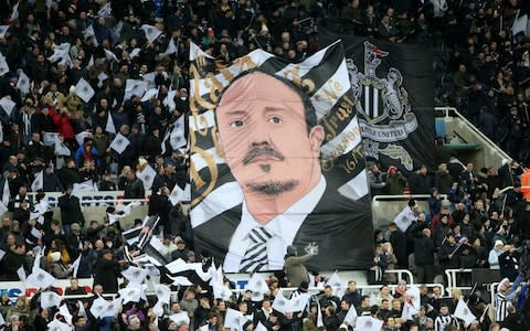 Newcastle United supporters celebrate the clubs 125th anniversary with a huge banner of Manager Rafa Benitez at St. James Park ahead of the Premier League match between Newcastle United and Leicester City at St. James Park on December 9th, 2017 in Newcastle Upon Tyne, United Kingdom - Credit: Getty Images