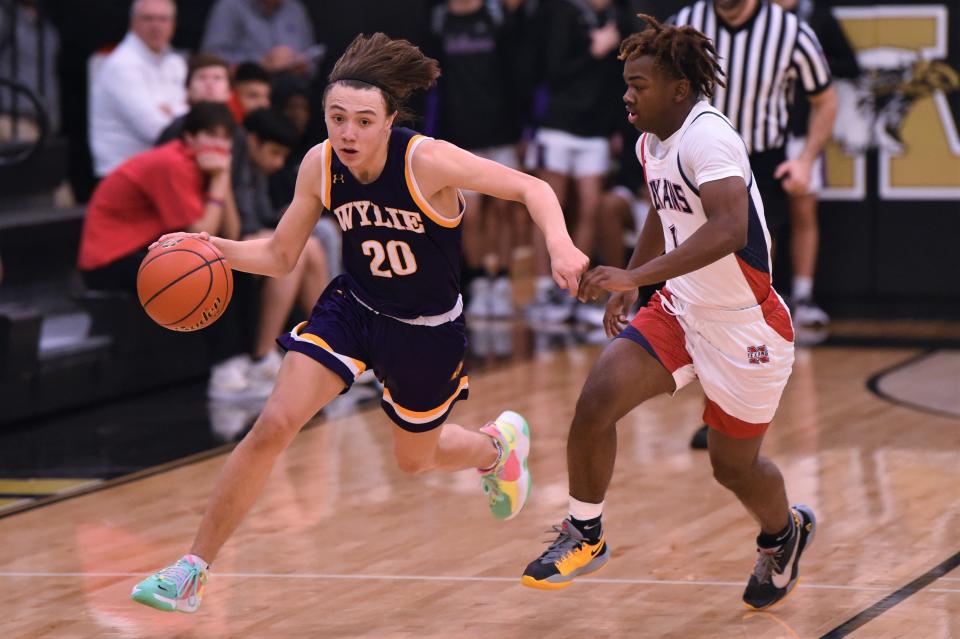 Wylie's Isaiah Carrillo (20) races down the court during Saturday's game against Justin Northwest on the final day of the Key City Classic.