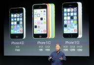 Phil Schiller, senior vice president of worldwide marketing for Apple Inc, talks about the pricing of their new products at Apple Inc's media event in Cupertino, California September 10, 2013. REUTERS/Stephen Lam (UNITED STATES - Tags: BUSINESS SCIENCE TECHNOLOGY BUSINESS TELECOMS)