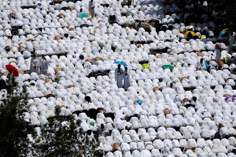 FILE PHOTO: Muslim pilgrims pray outside Namira Mosque on the plains of Arafat during the annual haj pilgrimage, outside the holy city of Mecca