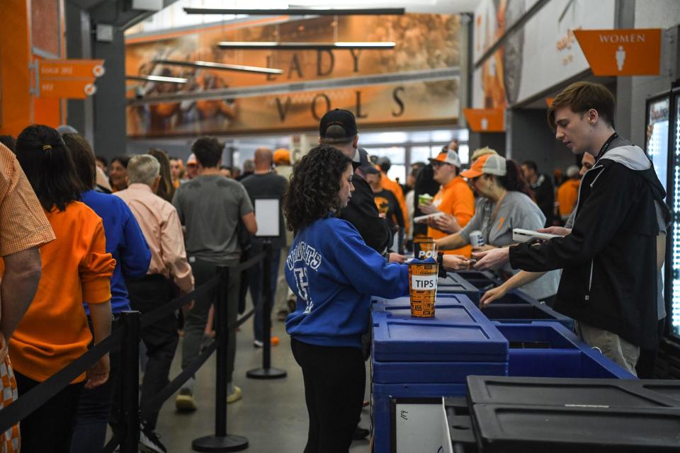 A fan purchases beer at Thompson-Boling Arena at Food City Center before Tennessee takes on Kentucky on March 9, 2024. The venue has been selling beer since 2019 through its vendor, Aramark, which is looking to expand where alcohol could be served.