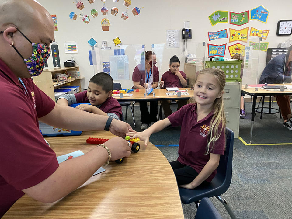 The Arizona Autism Charter School’s Early Learning Center uses station teaching to facilitate one-on-one and small group instruction. Teacher D’Von Auna works with one of his students using a STEAM Lego Kit. (Arizona Autism Charter)