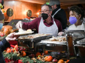 <p>Also at the 42nd annual free Christmas dinner and show event at The Laugh Factory, Tim Allen and Jane Hajduk serve food to attendees.</p>