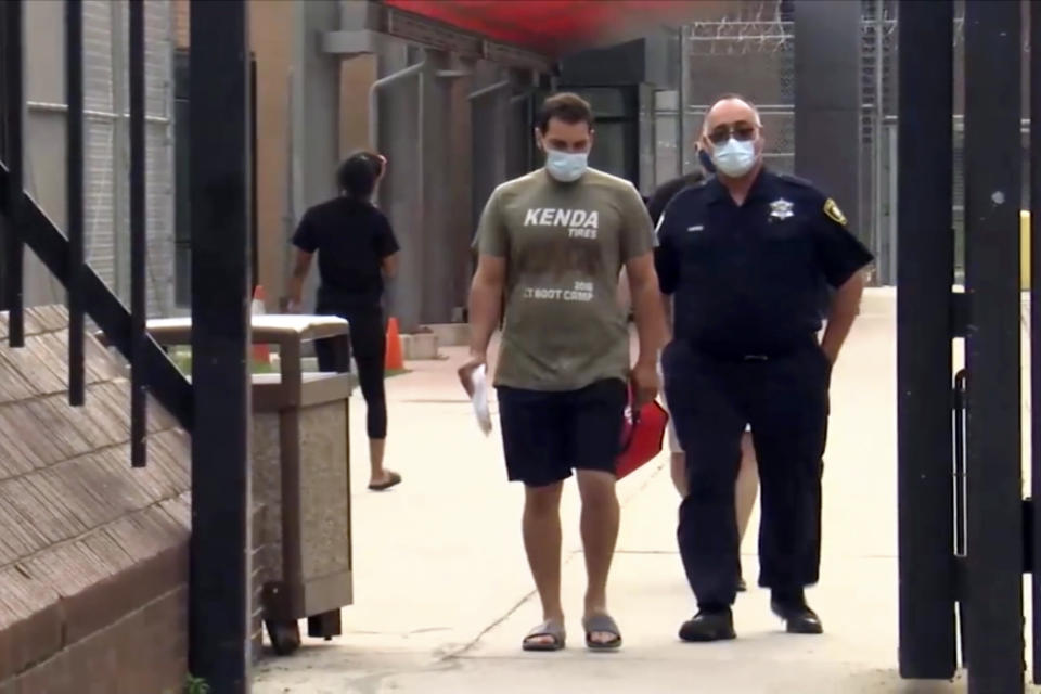 FILE - In this image taken from video provided from ABC7, Keegan Casteel leaves jail at the 18th District police headquarters, July 7 2021, in Chicago. On Monday, Aug. 28, 2023, prosecutors dropped all felony charges against Casteel, an Iowa man who was arrested in 2021 by Chicago police for having guns and ammunition in his hotel room overlooking a popular tourist attraction. (ABC7 via AP, File)