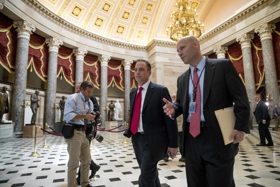 House OKs GOP health bill, a step toward Obamacare repeal. White House Chief of Staff Reince Priebus, center, walks near the House Chamber on Capitol Hill in Washington. (AP Photo/Andrew Harnik)