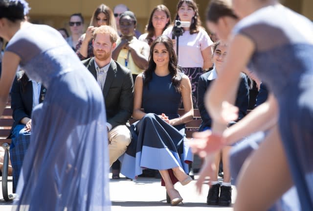 Prince Harry and Meghan Markle watching dance performance