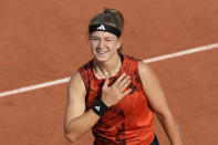 Karolina Muchova of the Czech Republic celebrates winning her semifinal match of the French Open tennis tournament against Aryna Sabalenka of Belarus in three sets, 7-6 (7-5), 6-7 (5-7), 7-5, at the Roland Garros stadium in Paris, Thursday, June 8, 2023. (AP Photo/Christophe Ena)