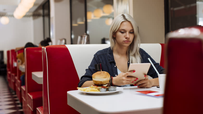 Woman eating alone