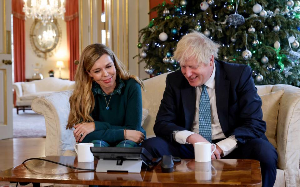 The Prime Minister Boris Johnson and his then-fiance inside No 10 Downing Street during the festive period - Andrew Parsons/No10 Downing Street