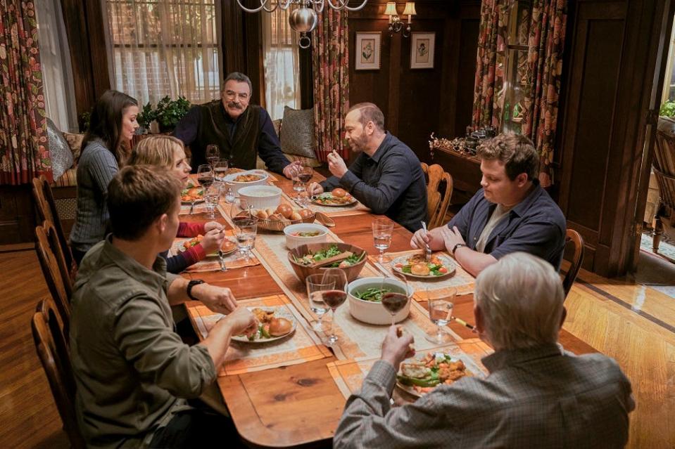 The Sunday dinner "Blue Bloods" staple will continue in Season 14. (L-R) Will Estes as Jamie Reagan, Vanessa Ray as Officer Eddie Janko, Bridget Moynahan as Erin Reagan, Tom Selleck as Frank Reagan, Donnie Wahlberg as Danny Reagan, Andrew Terraciano as Sean Reagan, and Len Cariou as Henry Reagan.