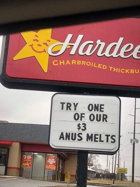 sign reading try one of our $3 anus melts below a Hardee's logo