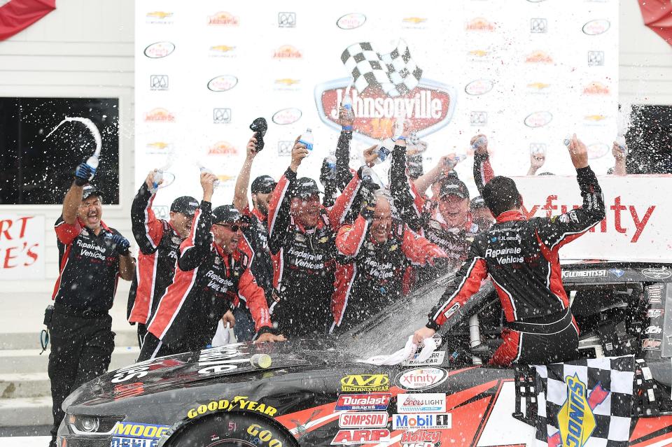Jeremy Clements and his crew celebrate in victory lane the 2017 Johnsonville 180, his first NASCAR victory.