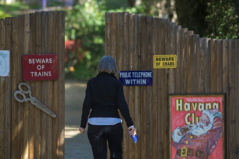 A visitor approaches the gates to the driveway leading to the home of actress and author Carrie Fisher, best known for playing the role of Princess Leia in 'Star Wars', who passed away in Los Angeles, California, on December 27, 2016