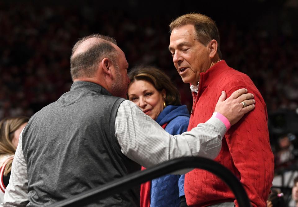 Former Alabama football head coach Nick Saban and his wife Terry are greeted by friends at Coleman Coliseum on Feb. 17, 2024. Saban announced his retirement on Jan. 10.
