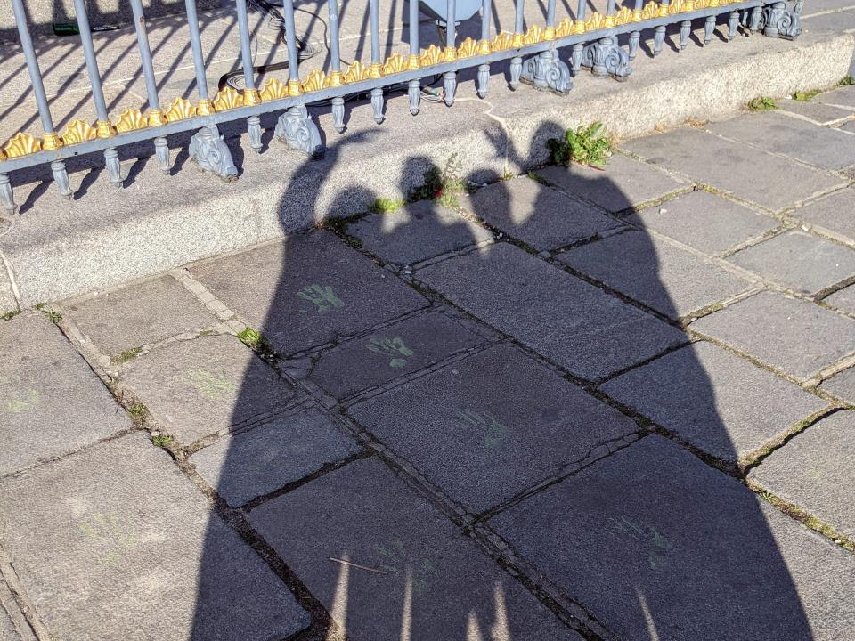 Family posing for a shadow selfie