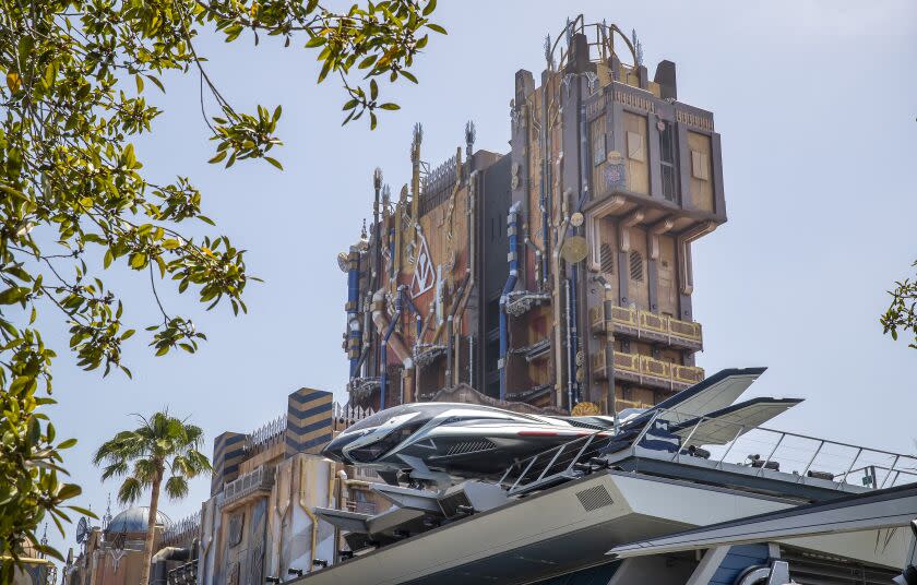A Quinjet rests high atop the Avengers Headquarters building at California Adventure.
