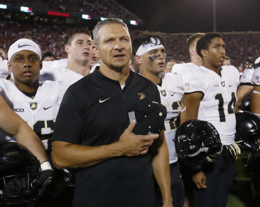 Army head coach Jeff Monken stands with his team after of an NCAA college football game against Oklahoma in Norman, Okla., Saturday, Sept. 22, 2018. Oklahoma won 28-21 in overtime. (AP Photo/Sue Ogrocki)
