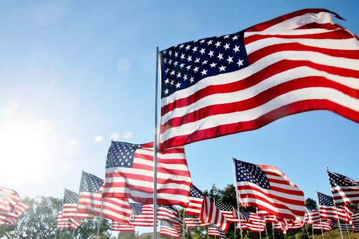 A bunch of United States flags blow in the wind in Malibu, CA