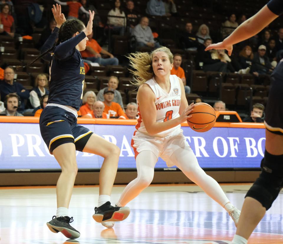 Bowling Green's Morgan Sharps attempts to shake free of Kent State's Katie Shumate Jan. 27. Sharps and Shumate, Newark graduates, combined to score 56 points.
