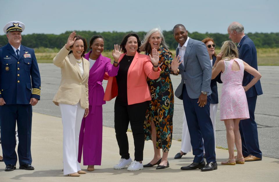 Vice President Kamala Harris, second from left to right, Attorney General Andrea Campbell, Lt. Gov. Kim Driscoll, Congresswoman Katherine Clark and Harris' brother-in-law Tony West pose for photos and acknowledge the press gathered for her arrival Saturday afternoon. 
Vice President Kamala Harris arrived at Air Station Cape Cod Saturday, July 20, 2024. Air Force Two landed shortly before 1 p.m. at the Coast Guard air station. She was greeted by a group of officials before getting into a vehicle for a caravan to Provincetown. Harris attended a fundraiser at the Pilgrim Monument Saturday afternoon. 
Merrily Cassidy/Cape Cod Times