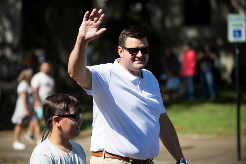 Brooks Massey, 8, and AJ Massey, the Madison County mayor-elect, wave to attendees during the Celebration Parade as part of the Jackson-Madison County Bicentennial on Saturday, August 13, 2022, in Jackson, Tenn. 