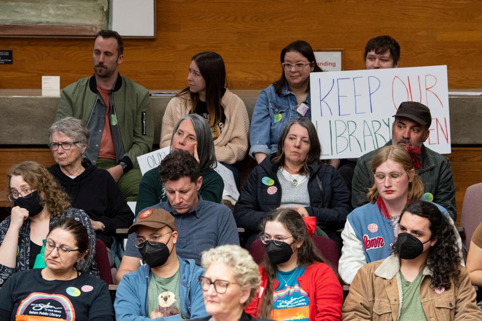 Salem residents listen to public testimony against proposed library cuts during the budget committee meeting Wednesday evening.