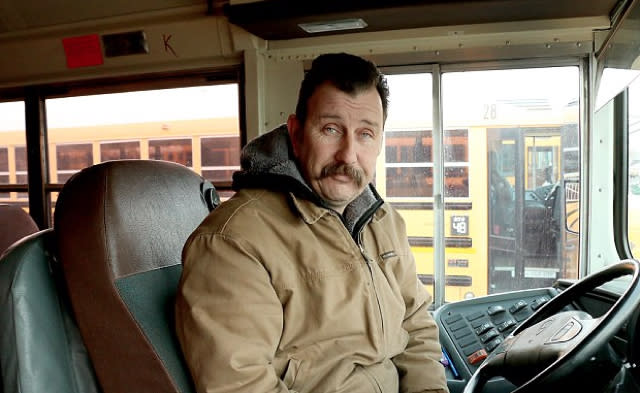 Bus driver buys hats and gloves for cold school children