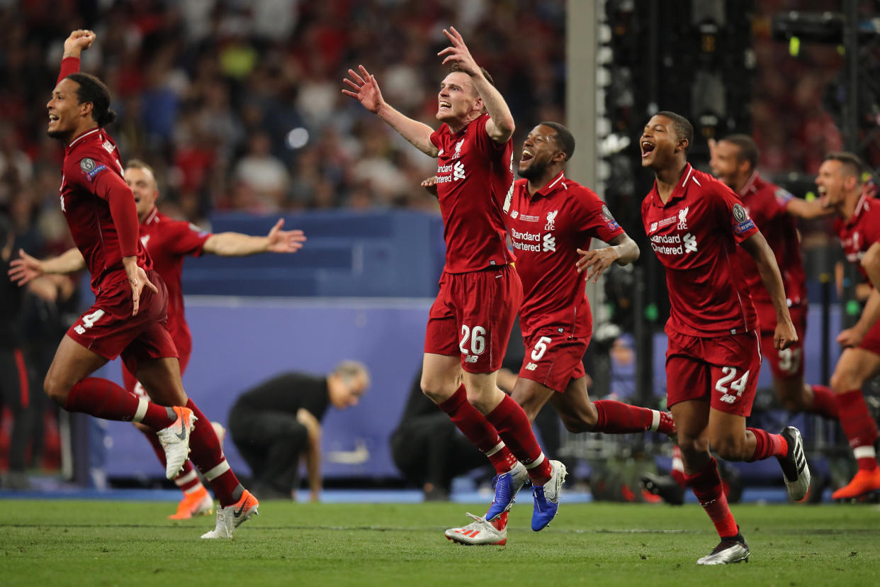 MADRID, SPAIN - JUNE 01: Andrew Robertson of Liverpool and teammates celebrate after winning the champions league final after the UEFA Champions League Final between Tottenham Hotspur and Liverpool at Estadio Wanda Metropolitano on June 1, 2019 in Madrid, Spain. (Photo by Matthew Ashton - AMA/Getty Images)