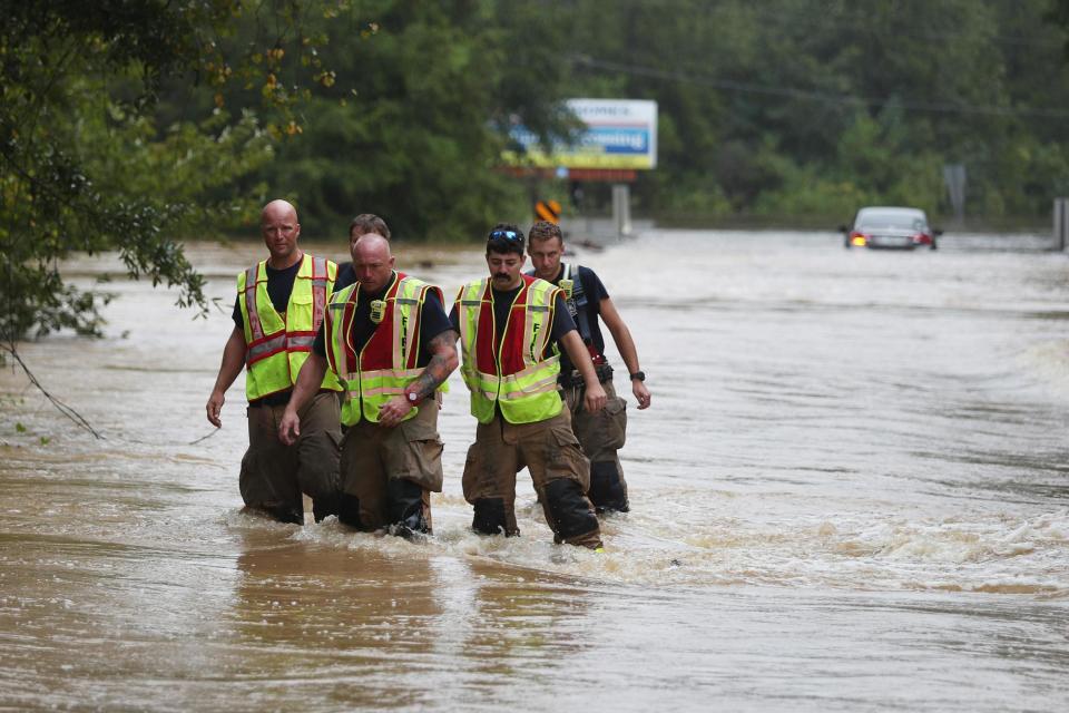 Firefighters wade through a flooded road after Hurricane Sally passed through Pensacola, Florida: Getty Images