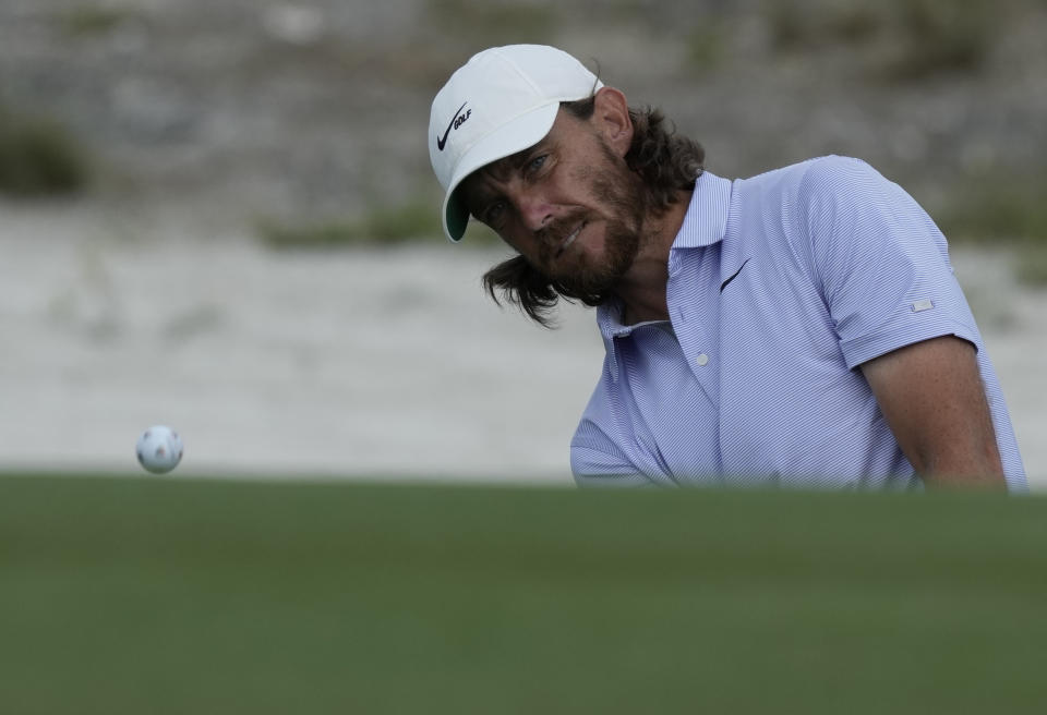 Tommy Fleetwood, of England, chips onto the first green during the third round of the Hero World Challenge PGA Tour at the Albany Golf Club, in New Providence, Bahamas, Saturday, Dec. 3, 2022. (AP Photo/Fernando Llano)