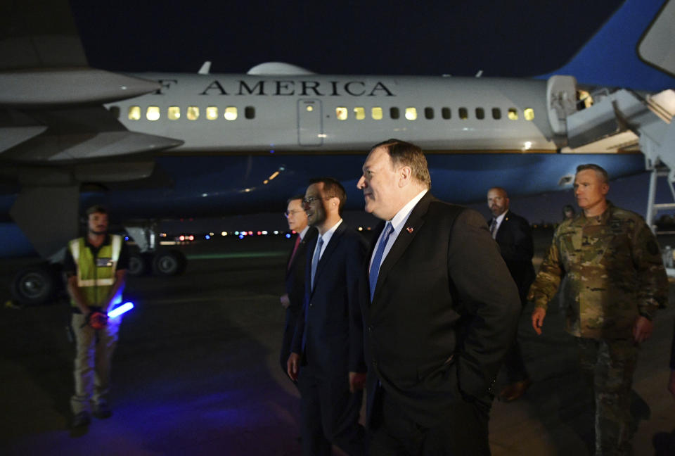 U.S. Secretary of State Mike Pompeo, center, walks with Acting Assistant Secretary for Near Eastern Affairs at the State Department David Satterfield, left, and Charge D'affaires at the U.S. Embassy in Baghdad Joey Hood, second from left, and Lt. Gen. Paul LeCamera after arriving in Baghdad, late Tuesday, May 7, 2019. (Mandel Ngan/Pool Photo via AP)