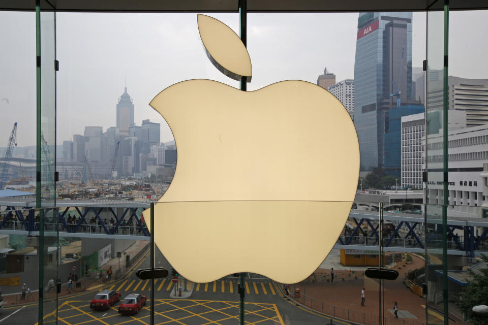 In this Sept. 24, 2011, photo, an Apple logo is displayed at the Apple store in the International Financial Center (IFC) shopping Mall, in Hong Kong. Apple became the latest company targeted for Chinese pressure over protests in Hong Kong when the ruling Communist Party's main newspaper criticized the tech giant Wednesday for a smartphone app that allows activists to report police movements. (AP Photo/Kin Cheung)