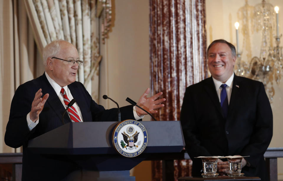 Secretary of State Mike Pompeo, right, listens as President of the World Food Prize Foundation and former U.S. Ambassador to Cambodia, Kenneth M. Quinn, left, speaks during the announcement of the World Food Prize Laureate at the State Department, Monday, June 10, 2019. Simon N. Groot of the Netherlands, founder of East-West Seed, will receive the 2019 World Food Prize. (AP Photo/Pablo Martinez Monsivais)