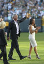 <p>With his wife, Deanna, at his side former Green Bay Packers quarterback Brett Favre waves to fans as he walks off Lambeau Field prior to his induction into he Packers Hall of Fame and having his No. 4 jersey retired, Saturday, July 18, 2015, in Green Bay, Wis. (AP Photo/Mike Roemer)</p>