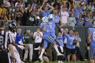 Tulane quarterback Michael Pratt (7) jumps as he celebrates a touchdown with Tulane wide receiver Lawrence Keys III (6) against Central Florida during the second half of the American Athletic Conference championship NCAA college football game in New Orleans, Saturday, Dec. 3, 2022. (AP Photo/Matthew Hinton)