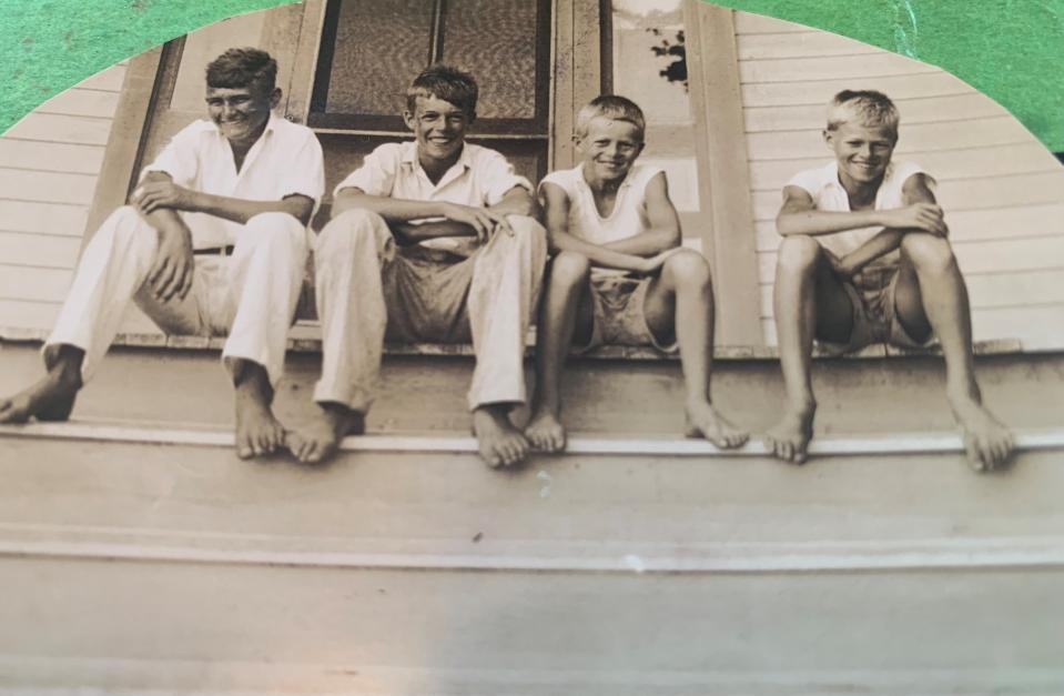 From left, a person identified only as Walter, sits with Robert, Arthur and Charles Harlock of Wabasso, Florida, in this undated family picture.