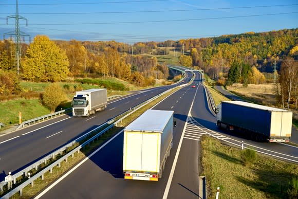 Freight trailers on a highway.