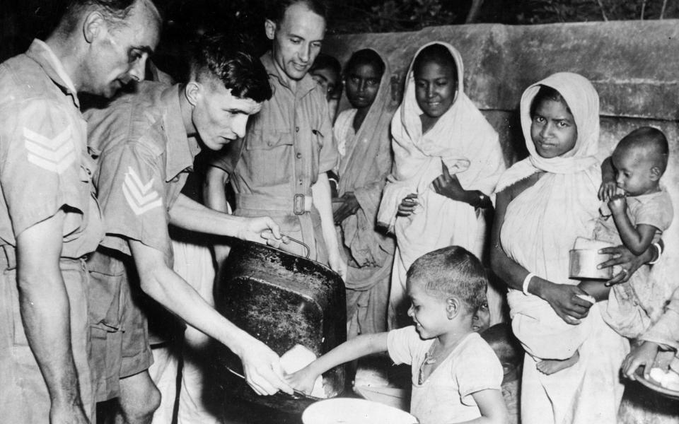 RAF personnel feeding famine victims in Bengal in 1943 - Mirrorpix