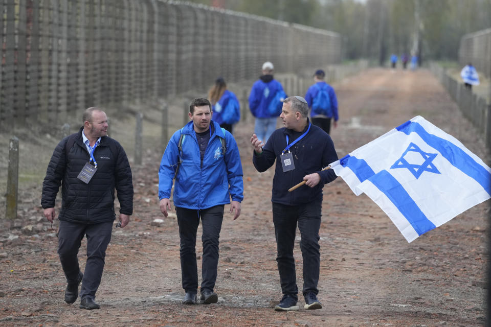 Jewish people visit the Auschwitz Nazi concentration camp after the March of the Living annual observance that was not held for two years due to the global COVID-19 pandemic, in Oswiecim, Poland, Thursday, April 28, 2022. Only eight survivors and some 2,500 young Jews and non-Jews are taking part in the annual march that is scaled down this year because of the war in neighboring Ukraine that is fighting Russia's invasion. (AP Photo/Czarek Sokolowski)